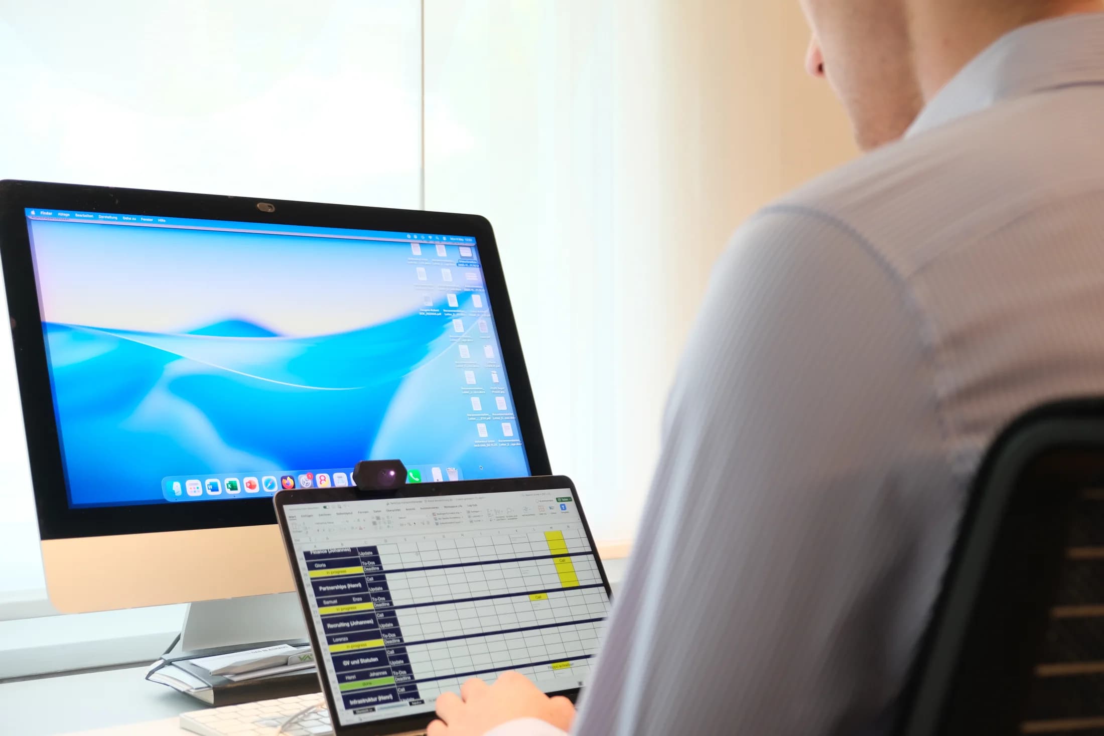 A person working at a desk with Attodot's sensor in view